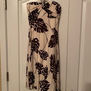 Off white dress with brown leaves.